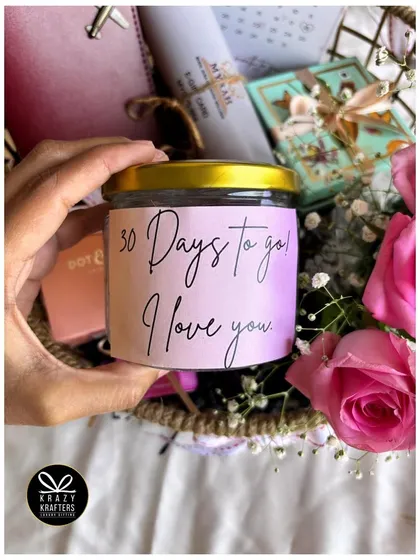 This personalized candle, labeled '30 Days to go! I love you', adds a romantic and personal touch to a countdown hamper.
