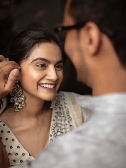 A beautiful, candid moment between a couple during their pre-wedding shoot. The genuine smile is what we always aim to capture.