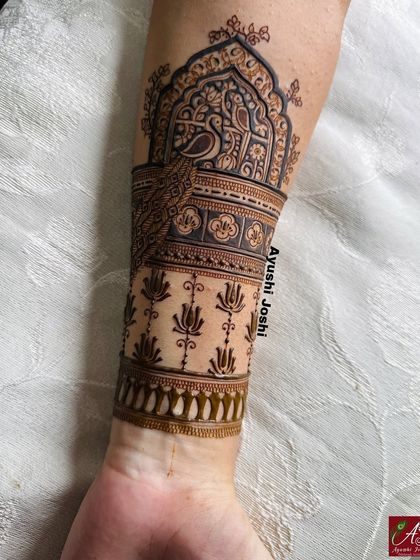 The full arm band for the baby shower design, with a peacock motif above a pattern of blooming lotuses.