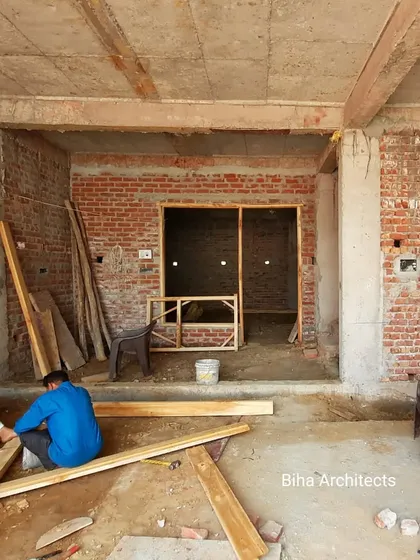 This image captures our carpenters at work, crafting wooden frames for doors and windows on site. We manage all aspects of site work to ensure that every element, from the structural to the decorative, is executed to our exacting standards.