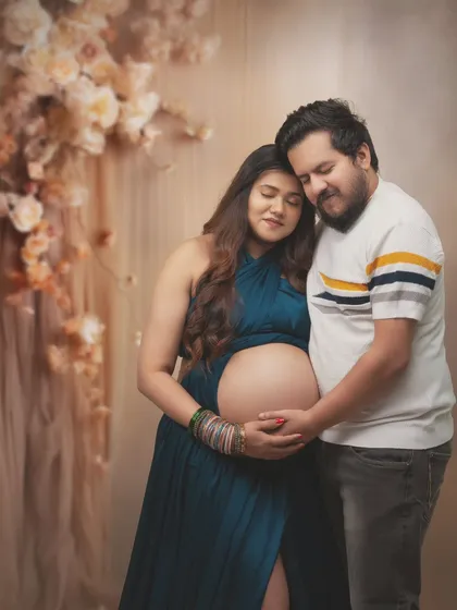 A tender embrace against a soft, floral backdrop. Their closed eyes and gentle touch convey a sense of peace and deep connection. This is a portrait of two souls completely lost in their love for each other and their baby.