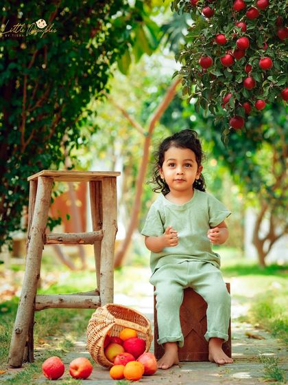 A quiet moment in the apple orchard. The soft, natural light of this outdoor session creates a serene and beautiful portrait.