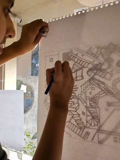 Shreya meticulously working on her drawing. This was a new way of drawing for her, and it was a remarkable achievement to produce such a complex piece in just one week.