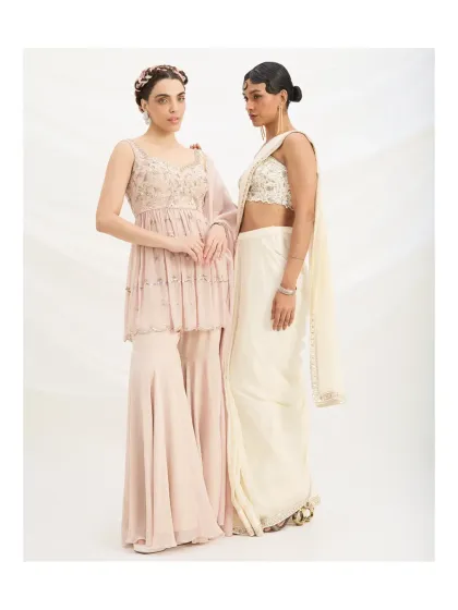 The gentle drape of the fabrics and the soft colour palette make these outfits ideal for any daytime festive event. They are light, comfortable, and undeniably chic.