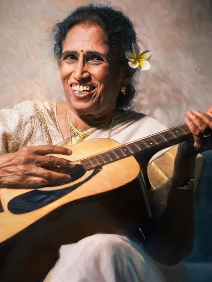 A radiant smile captured in a moment of musical joy. The flower in her hair adds a touch of softness to this painterly portrait, celebrating her vibrant spirit and love for life.