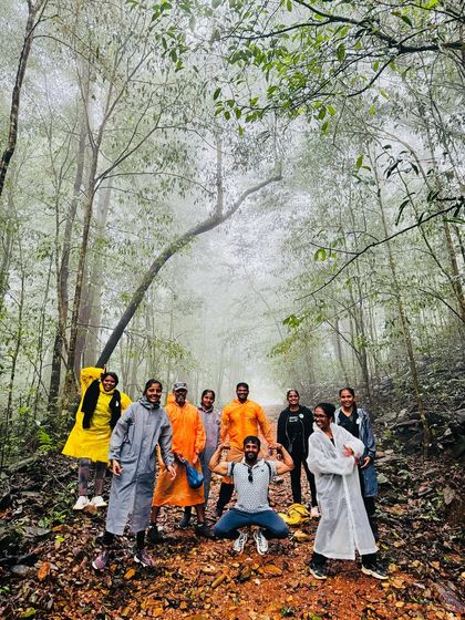 Our Kurinjal trek group posing in a misty forest clearing. The atmosphere in the Kudremukha National Park is truly magical.