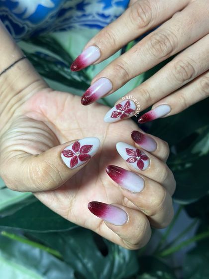 The contrast between the soft white base and the deep red tips is so striking.