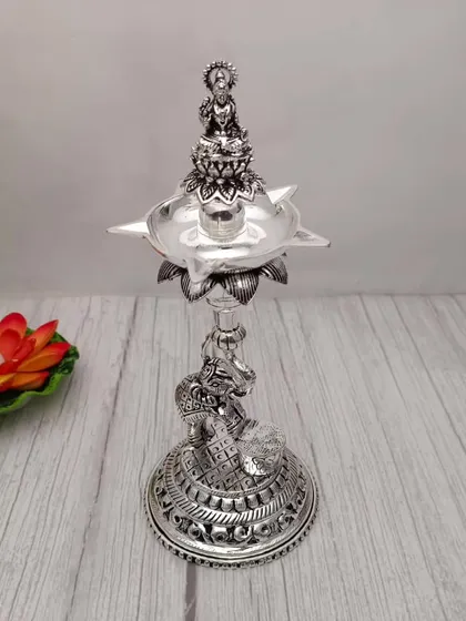 An antique Lakshmi diya with an elephant base, a unique design that is both sturdy and symbolic.