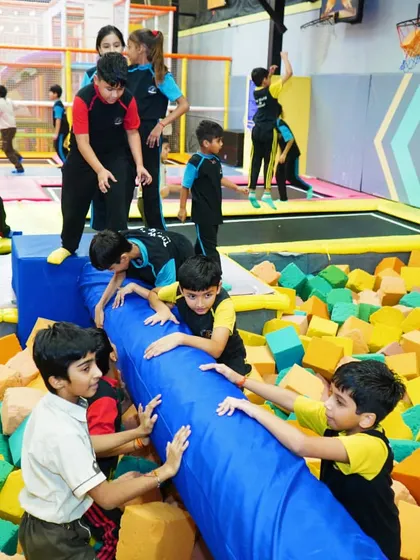 More fun from a school trip, with kids enjoying the foam pit and balance beam together.