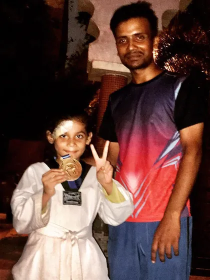 Another one of our young champions celebrating her win. We welcome and train students of all ages, helping each one reach their competitive goals.