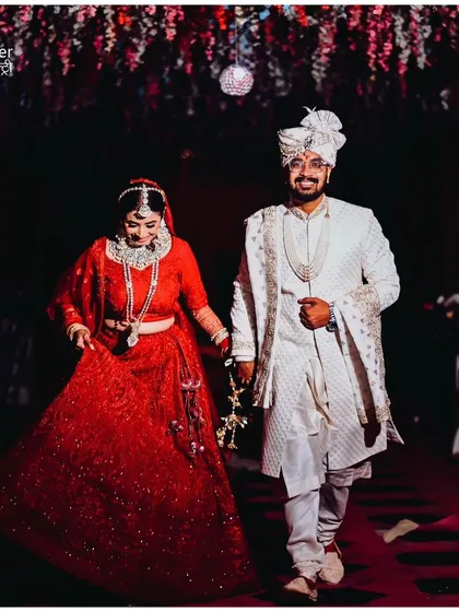 A beautiful candid shot of the couple walking together during the wedding ceremony, sharing a private smile. We are always looking for these unposed, genuine moments.