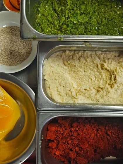 The building blocks of my Kolhapuri cuisine: Kharda, ginger-garlic paste, tikat masala, ghee, and sesame seeds. These core ingredients are the secret to my tagline: Grub, Love, Happiness.