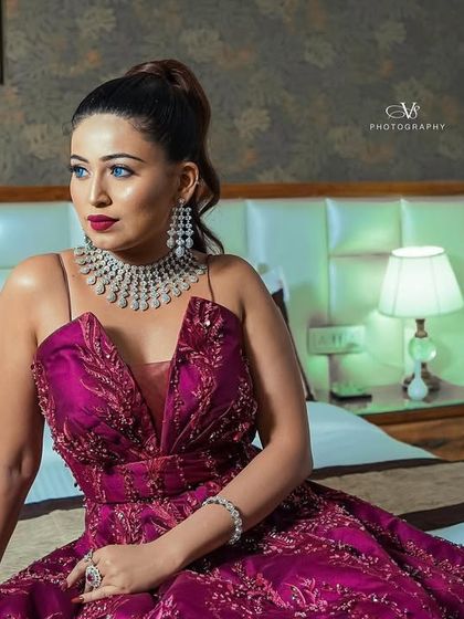 A glamorous shot of the bride looking away, capturing her sophisticated style and the anticipation of the evening.