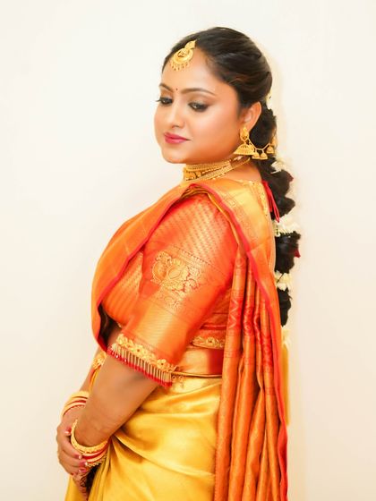 A soft, elegant profile. The makeup is subtle, with a focus on enhancing her natural features and creating a gentle, luminous glow.