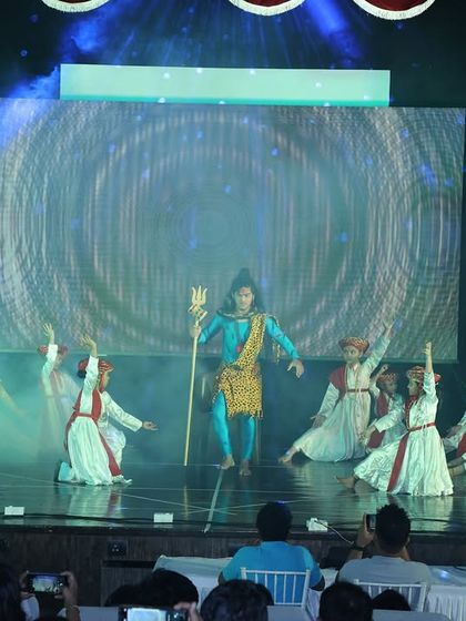 The combination of smoke effects, dramatic lighting, and devotional postures creates a spiritual atmosphere for our Shiv prayer performance.