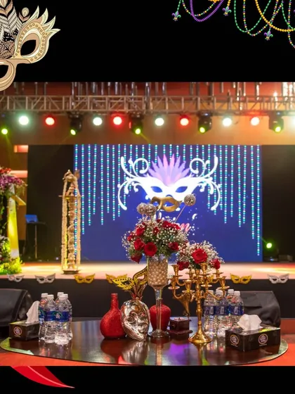 For a corporate celebration, I designed this entire masquerade ball theme. The setup included a custom stage with a large LED screen displaying thematic graphics, professional lighting trusses, and elegant table arrangements to create a mysterious and beautiful atmosphere.