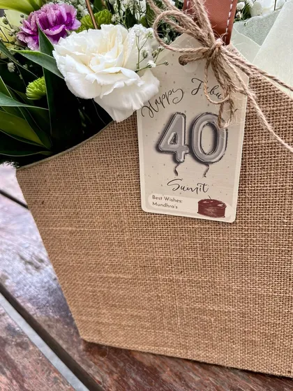The personalized tag for the 40th birthday gift, adding a custom touch that makes the gesture all the more thoughtful.