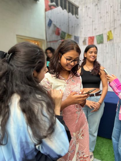 Candid moments of connection and friendship at our workshop. Our community is built on shared laughter and mutual support.