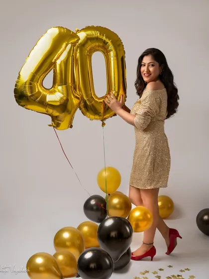 A playful and happy shot from the same 40th birthday session. The gold sequin dress and bright smile perfectly capture the celebratory spirit of the day.