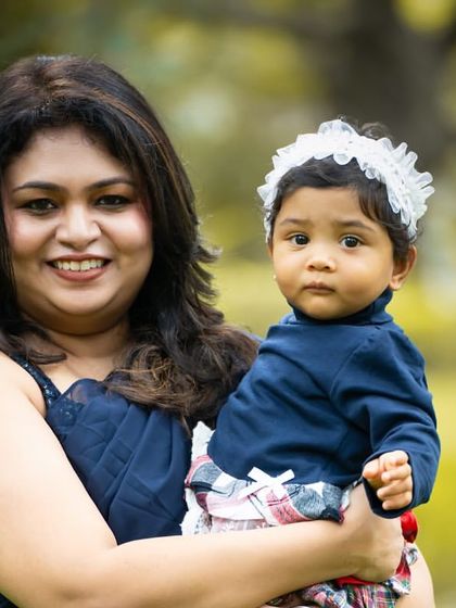 A sweet and simple portrait of a mother and her daughter. The soft, natural light of the outdoors is perfect for these gentle moments.
