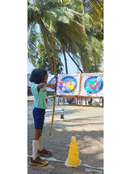 This young girl is ready for the balloon challenge. These activities help build skills in a playful, low-pressure environment.