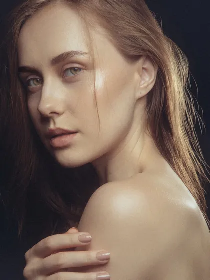 This final shot from the series showcases the clean, polished finish of the makeup. It's a testament to the importance of skin preparation and light-handed application for achieving a truly natural look.