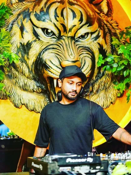 Behind the decks at my residency at Badmaash, with the iconic tiger logo watching over the party. This venue is one of my second homes, where I spin the best Bollywood and commercial tracks every Sunday.