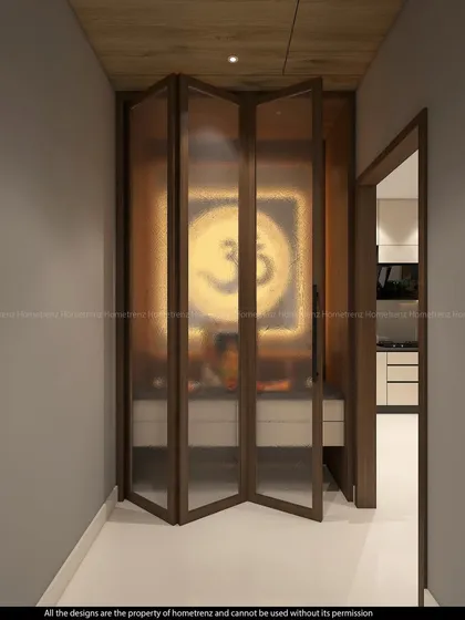 The foldable, frosted glass door of the pooja room, providing privacy while allowing light to filter through.