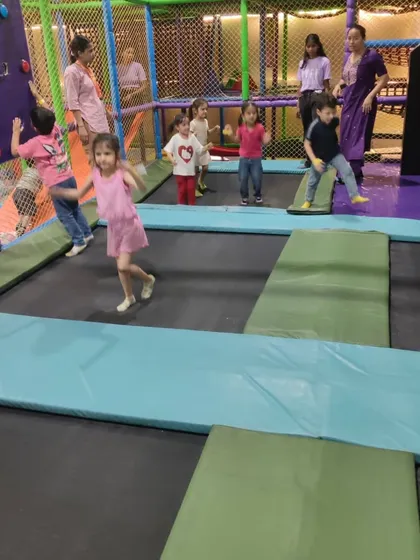 Bouncing high in our trampoline park. It's a great way for kids to burn off energy in a safe, netted environment.