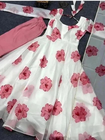 A lovely white and pink floral organza Anarkali suit. This lightweight and elegant fabric is perfect for a summer event.