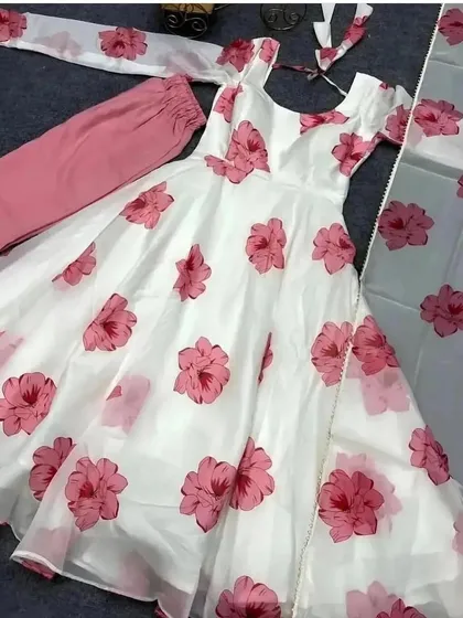 A lovely white and pink floral organza Anarkali suit. This lightweight and elegant fabric is perfect for a summer event.