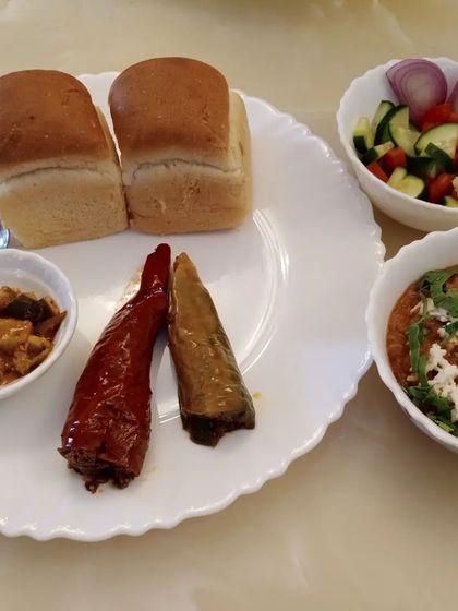 A closer look at the plate. The spicy stuffed red chilli and the tangy mango pickle add so much flavour to the meal.