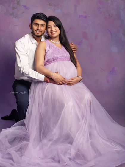 A lovely couple's portrait featuring our popular lavender tulle gown. The soft, romantic color and flowing fabric create a fairy-tale feel, perfectly capturing their shared joy.