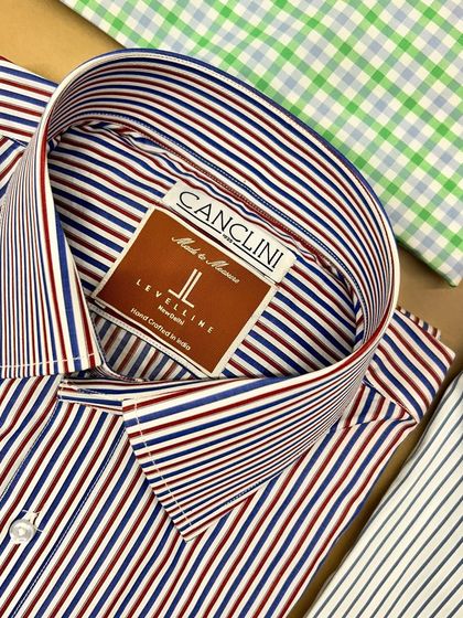 A freshly made custom shirt in a bold stripe, crafted from premium Canclini fabric. The crisp collar and quality material make it a standout piece for any office or casual look.