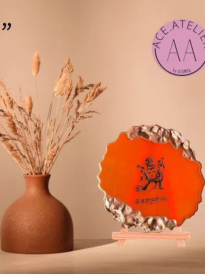 This 5-inch Hanumanji mantra frame in vibrant orange with a gold geode border is a powerful symbol of devotion.
