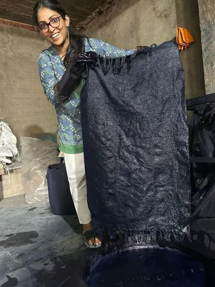 The moment of truth! Pulling the freshly dyed rug out of the natural indigo vat. It's always exciting to see the color develop as the fabric oxidizes.