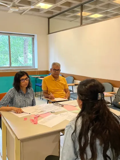 The oral production part of the DELF/DALF exam is a one on one interaction with certified examiners. This image shows a candidate engaging with our examiners in a supportive setting designed to assess their spoken French skills accurately.