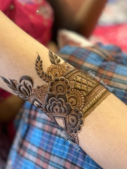 A close-up of the delicate armband that starts Afnaz's full Pakistani bridal design.