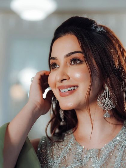 A close-up shot highlighting the soft, natural-looking makeup and statement earrings. This is a perfect example of my "less is more" glam.