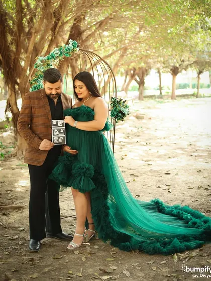 A precious moment as the couple looks at their sonogram pictures together. Incorporating personal items like this makes your photoshoot even more meaningful.