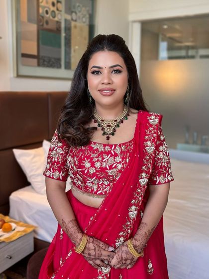 A simple and elegant look for this beautiful client. The focus is on clean skin, defined eyes, and a soft red lip that ties in with her stunning lehenga.