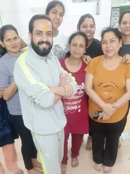 Celebrating Holi with my wonderful yoga students. Our studio is a community, and it's a joy to share these festive moments together.