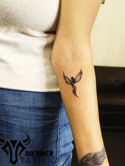 A small, minimalist phoenix silhouette on the forearm. A subtle yet powerful symbol of rising from the ashes.