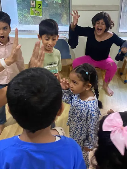 A high-energy moment in class. We believe learning should be joyful, and our classes are filled with laughter and playful exploration.