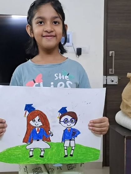 A cute drawing of two graduating students by Drisana from 3rd standard. This shows how students can use simple shapes and colors to tell a story.