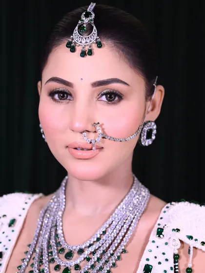 A close-up of my signature bridal makeup. Notice the clean, defined eyes, the perfectly blended skin, and the balanced features. This is the level of perfection and finishing I teach my students to achieve for their clients.