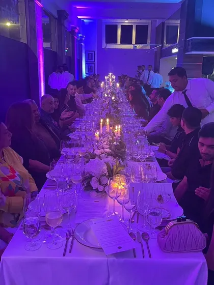 We can transform any space for an elegant sit-down dinner. This beautiful, candlelit long-table setup was for a sustainable farm-to-table meal, creating a truly memorable and intimate dining experience for the guests.