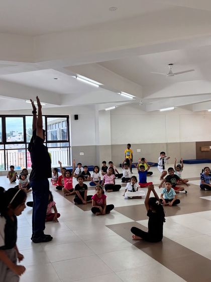 Proper form is essential, even in basic stretches. I demonstrate each move clearly so the children can follow along and learn the correct techniques for flexibility.