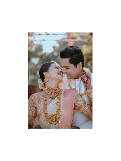A single, perfect frame capturing the couple's joyful smiles and loving gaze. Sometimes the simplest moments are the most powerful.