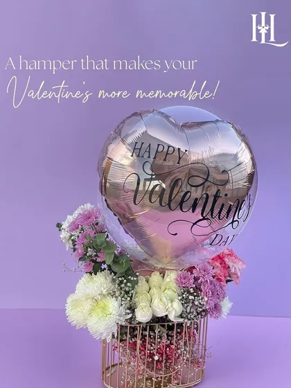 Make your Valentine's more memorable with this metal basket hamper. It's filled with a mix of fresh flowers and topped with a rose gold "Happy Valentine's Day" balloon.
